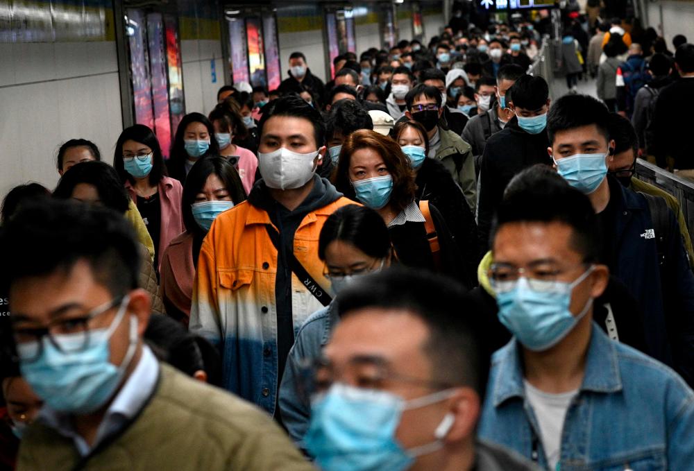 Commuters are seen at the subway during the morning rush hour in Beijing on October 19, 2021. AFPpix