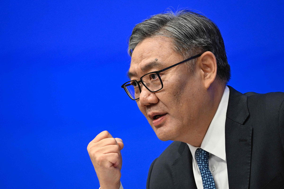 Wang Wentao, China’s Minister of Commerce, speaks during a press conference in Beijing on July 18, 2025. China's economy is still facing a very severe and complex situation, its minister of commerce said on July 18, suggesting the government would take action to counter challenges ahead. - AFP