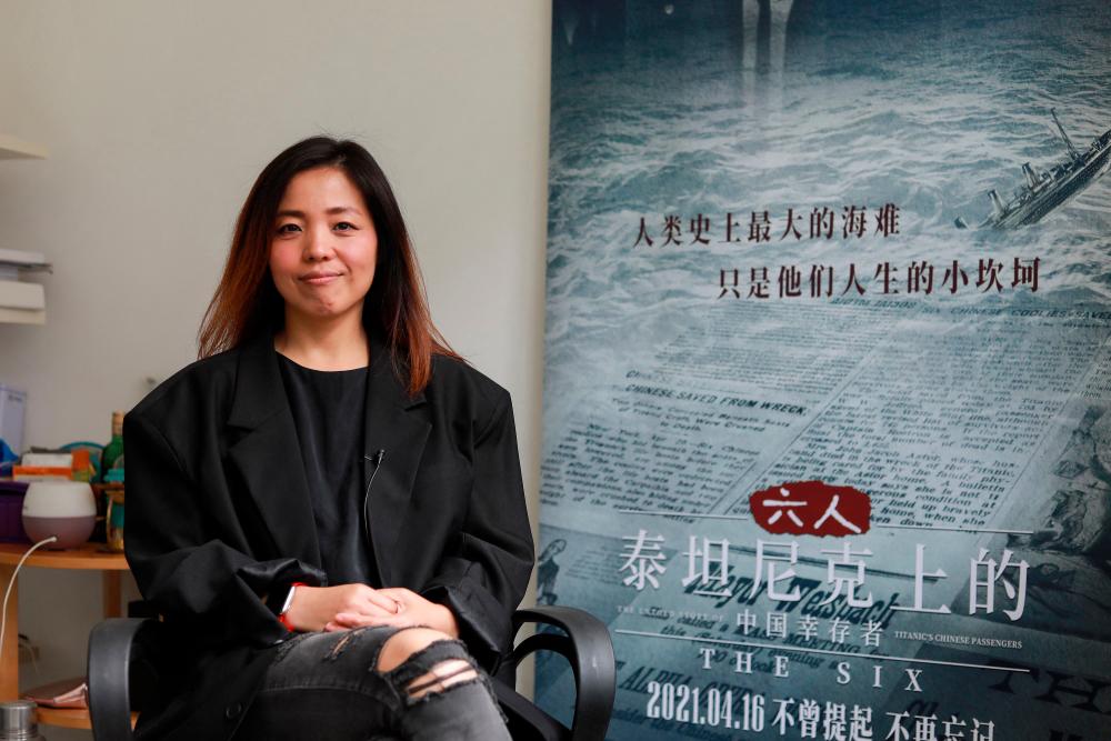 In this picture taken on April 20, 2021, Luo Tong, producer of a documentary about the Titanic's Chinese survivors, The Six, poses for a portrait during an interview in Shanghai. –AFP