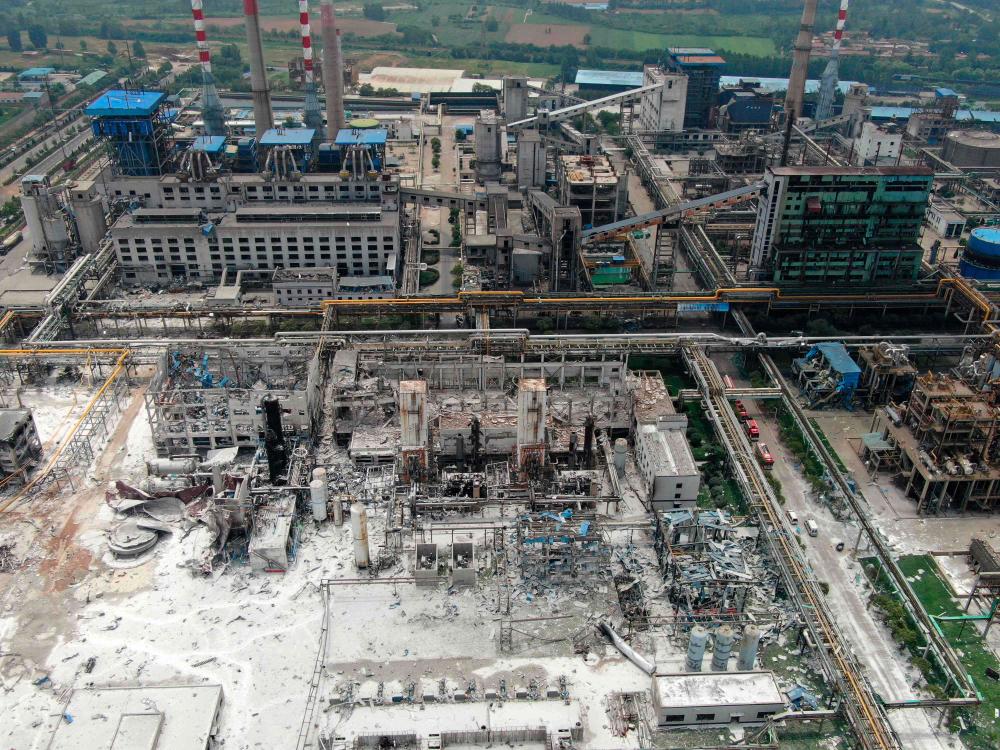 Damaged buildings are seen at the site of an explosion at the Henan Coal Gas Group factory in Yima city, in China's central Henan province on July 20, 2019. - AFP