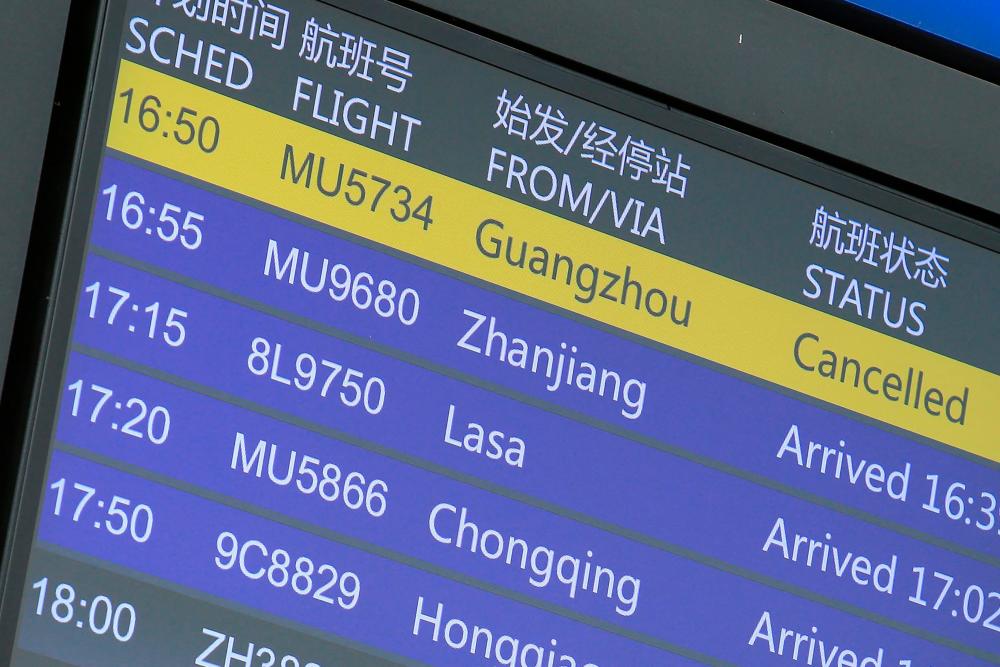 A flight information board shows a cancelled China Eastern Airlines flight (top L) at the Kunming Changshui International Airport in China's southwestern Yunnan province on March 21, 2022, after another China Eastern flight, MU5735, flying from Kunming to the southern hub of Guangzhou crashed in southwestern China. AFPpix