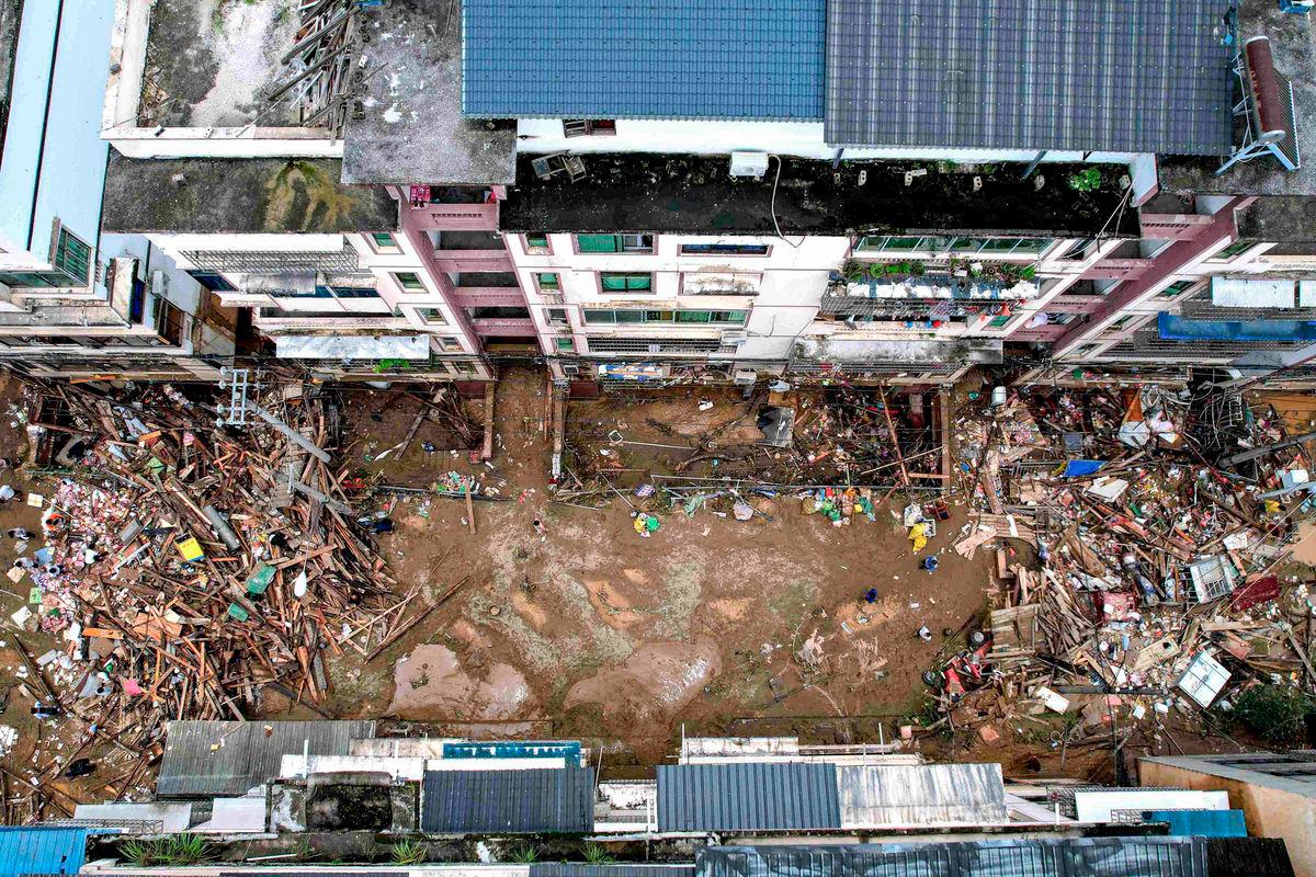 An aerial view of damaged buildings and debris in the aftermath of flooding in Congjiang, in southwestern China’s Guizhou province on June 25, 2025. (Photo by AFP)