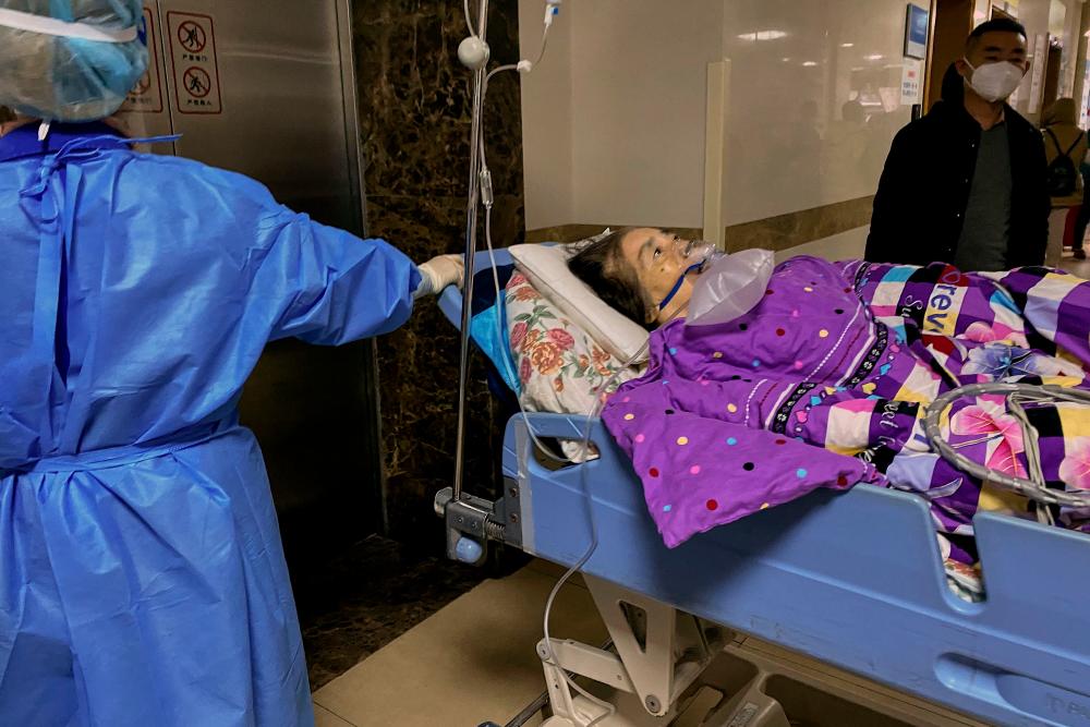 This picture shows a Covid-19 patient on a stretcher in the emergency ward of the First Affiliated Hospital of Chongqing Medical University in China’s southwestern city of Chongqing on December 22, 2022. AFPPIX