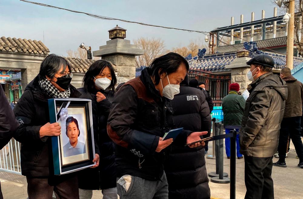 Workers at Beijing crematoriums said on December 16 they are overwhelmed as China faces a surge in Covid cases that authorities warn could hit its underdeveloped rural hinterland during upcoming public holidays/AFPPix