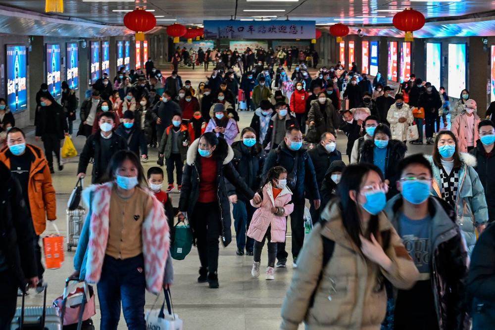 Passengers arrive to Hankou railway station in Wuhan, in Hubei province, on January 20, 2023, as people travel to their hometowns for Lunar New Year celebrations. AFPPIX