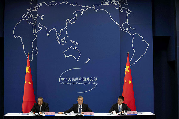 China’s Foreign Minister Wang Yi (C) speaks during a press conference briefing on the Belt and Road Summit at the Ministry of Foreign Affairs in Beijing on April 19, 2019. — AFP