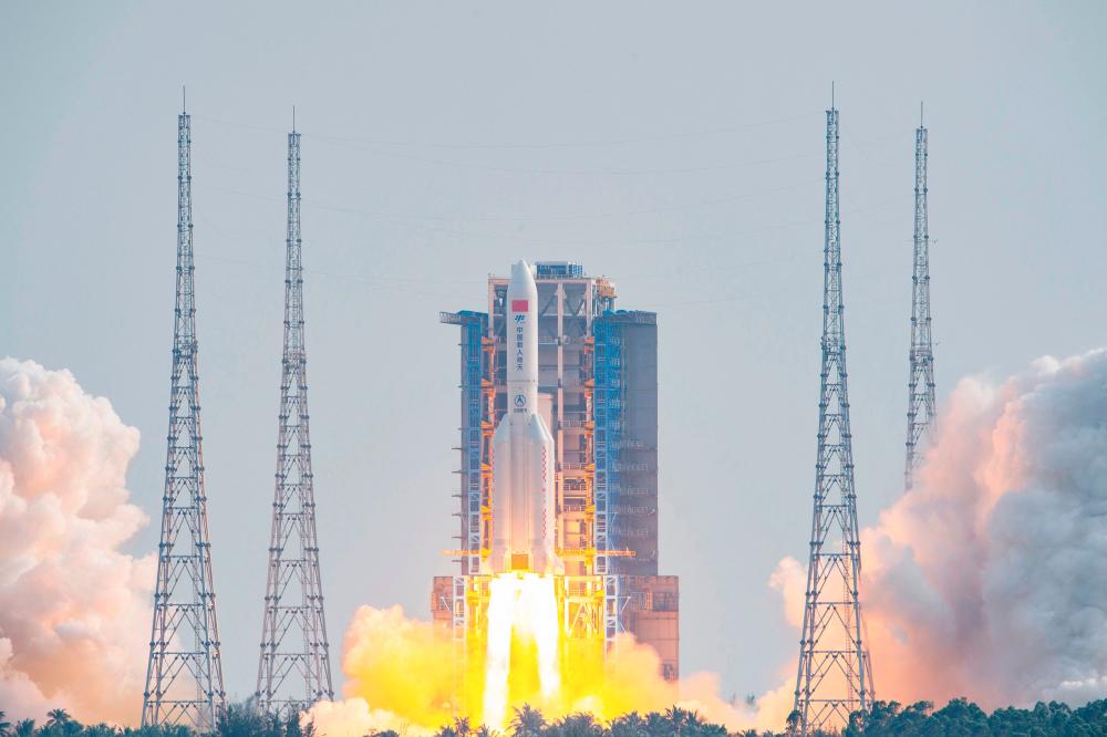 A Long March 5B rocket, carrying China's Mengtian science module, the final module of Tiangong space station, lifts off from the Wenchang Space Launch Centre in southern China's Hainan Province. – AFPPIX