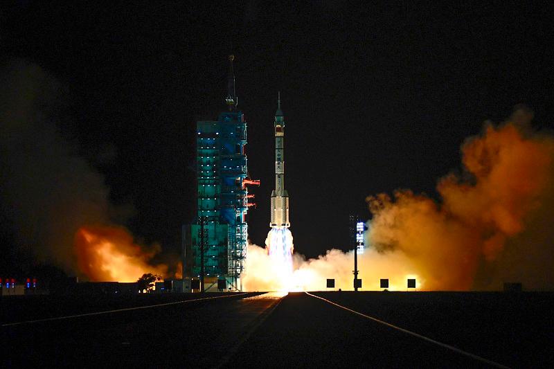 A long March-2F carrier rocket carrying the Shenzhou-19 spacecraft and crew of three astronauts lifts off from the Jiuquan Satellite Launch Center, in the Gobi desert, northwest China, on October 30, 2024. The mission of three astronauts to the Tiangong space station will carry out experiments with an eye to the space programme’s ambitious goal of placing astronauts on the Moon by 2030 and eventually constructing a lunar base. - ADEK BERRY / AFP