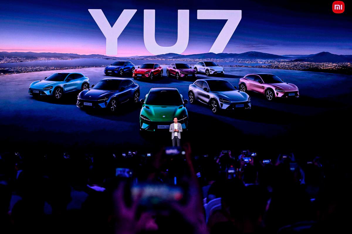 Lei Jun, Chairman and CEO of Chinese electronics company Xiaomi, introduces the Xiaomi YU7 car, during a launching event in Beijing on June 26, 2025. - AFPPIX