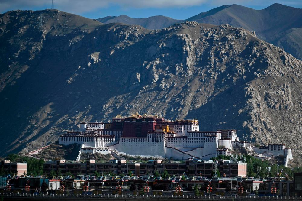 This photograph taken on June 2, 2021 during a government organised media tour shows the Potala Palace - classified as a World Heritage Site by UNESCO in 1994 - in the regional capital Lhasa, in China's Tibet Autonomous Region. Thirty-five million tourists flooded into the region last year, ten times the entire population of Tibet - prompted warnings that the influx could overwhelm traditional lifestyles and values. – AFP