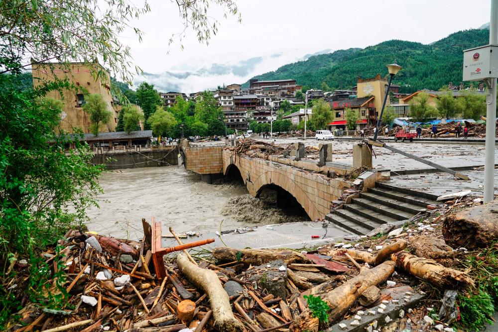 This photo taken on August 21, 2019 shows the aftermath of a mudslide caused by heavy rainfall in Wenchuan county, in China's southwestern Sichuan province. - AFP