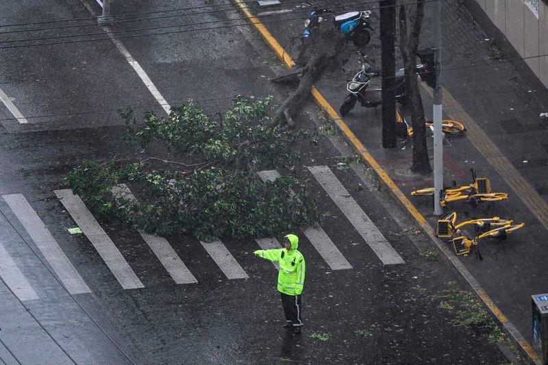 This picture shows a fallen bicycles on a road amid strong winds and rain from the passage of Typhoon Bebinca - AFPpix