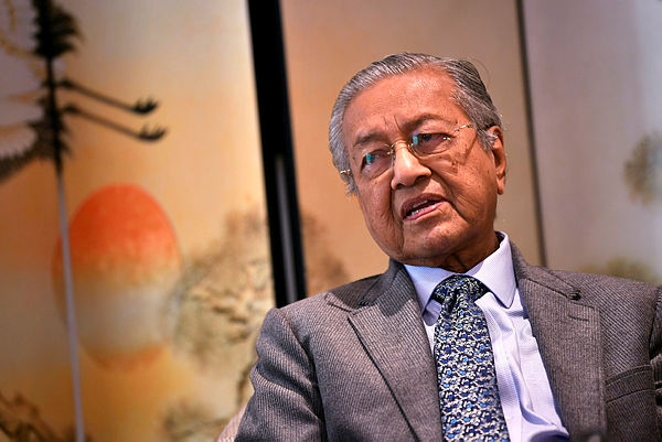 Prime Minister Tun Dr Mahathir Mohamad speaks to the Malaysian media in Beijing, at the end of his five-day visit to China on April 28, 2019. — Bernama