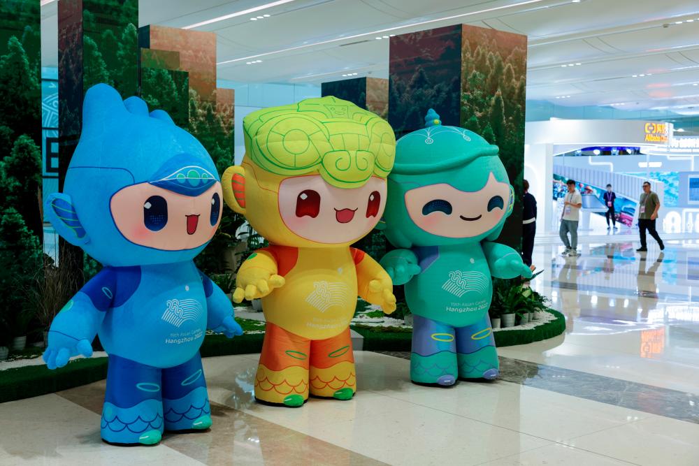Hangzhou Asian Games official mascots named (from left) Chenchen, Congcong and Lianlian on showcase at the media center today/BERNAMApix