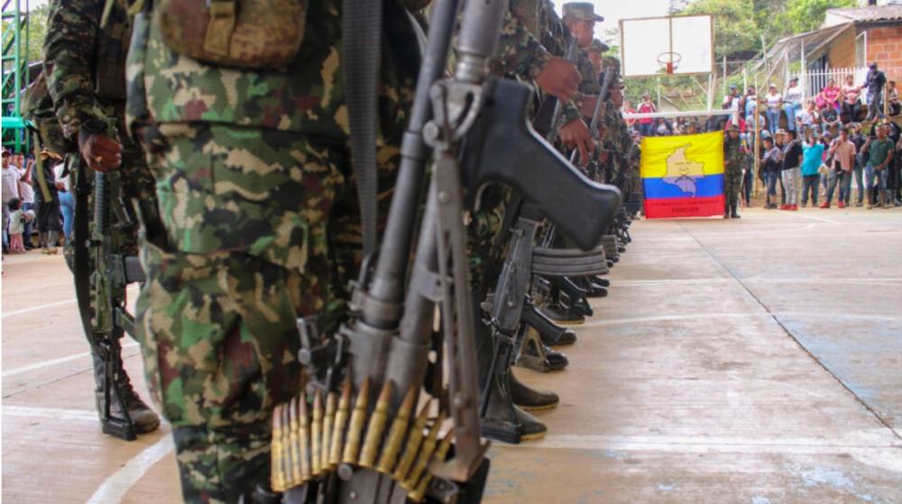 Several splinter groups of FARC dissidents – one of which is seen here attending a funeral in November 2022 -- have announced a cease-fire until the new year. AFPPIX