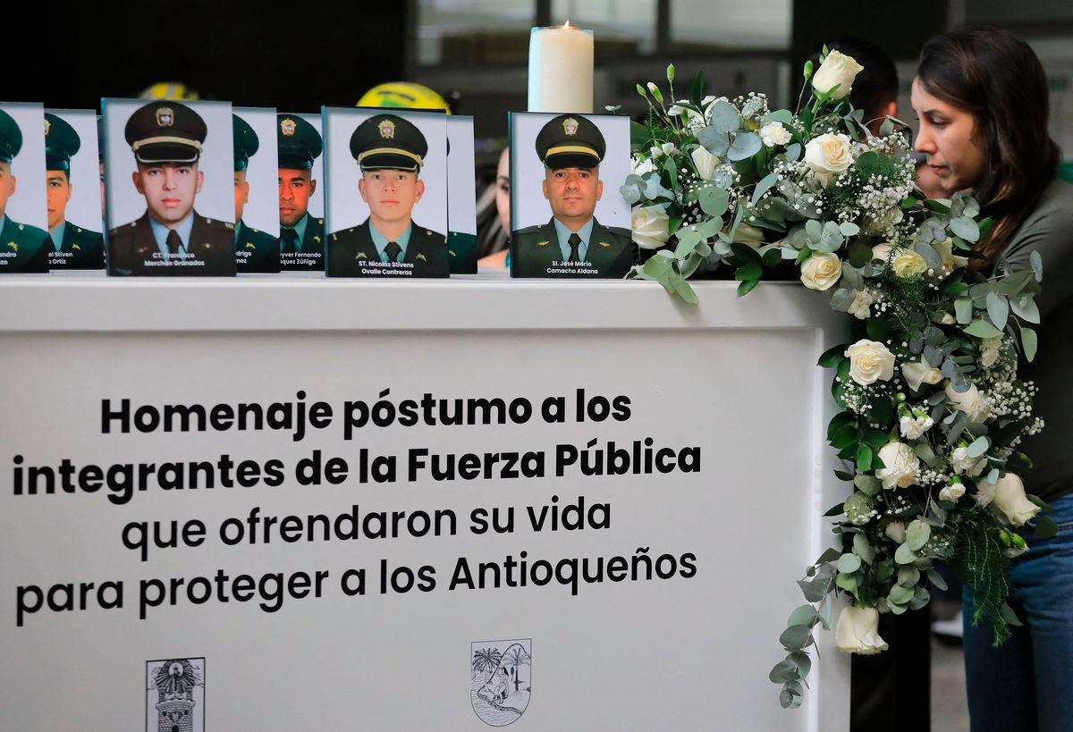 A relative attends during a tribute to 13 slain police officers at the office of the governor of Antioquia in Medellin, Colombia on August 28, 2025. The 13 police officers were killed in a guerrilla attack in Amalfi, Antioquia Department, on August 21, 2025, after a dissident faction of the FARC guerrilla group attacked their coca crop eradication operation in the northwest of the country, the local governor said. (Photo by JAIME SALDARRIAGA / AFP)