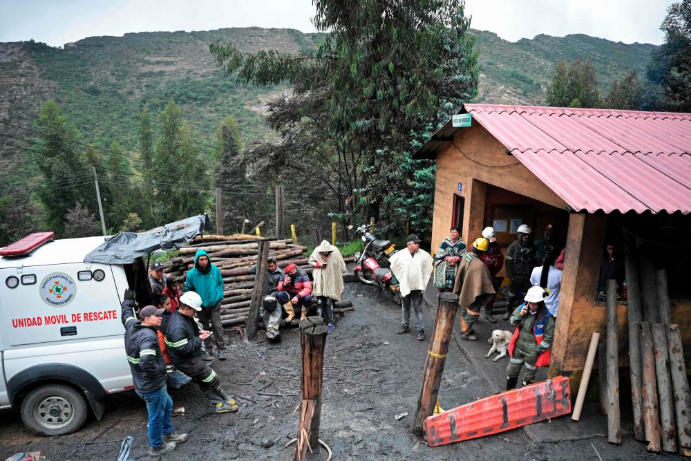 Miners and relatives wait for news after an explosion at a coal mine in Sutatausa municipality in the department of Cundinamarca, Colombia on March 15, 2023. AFPPIX