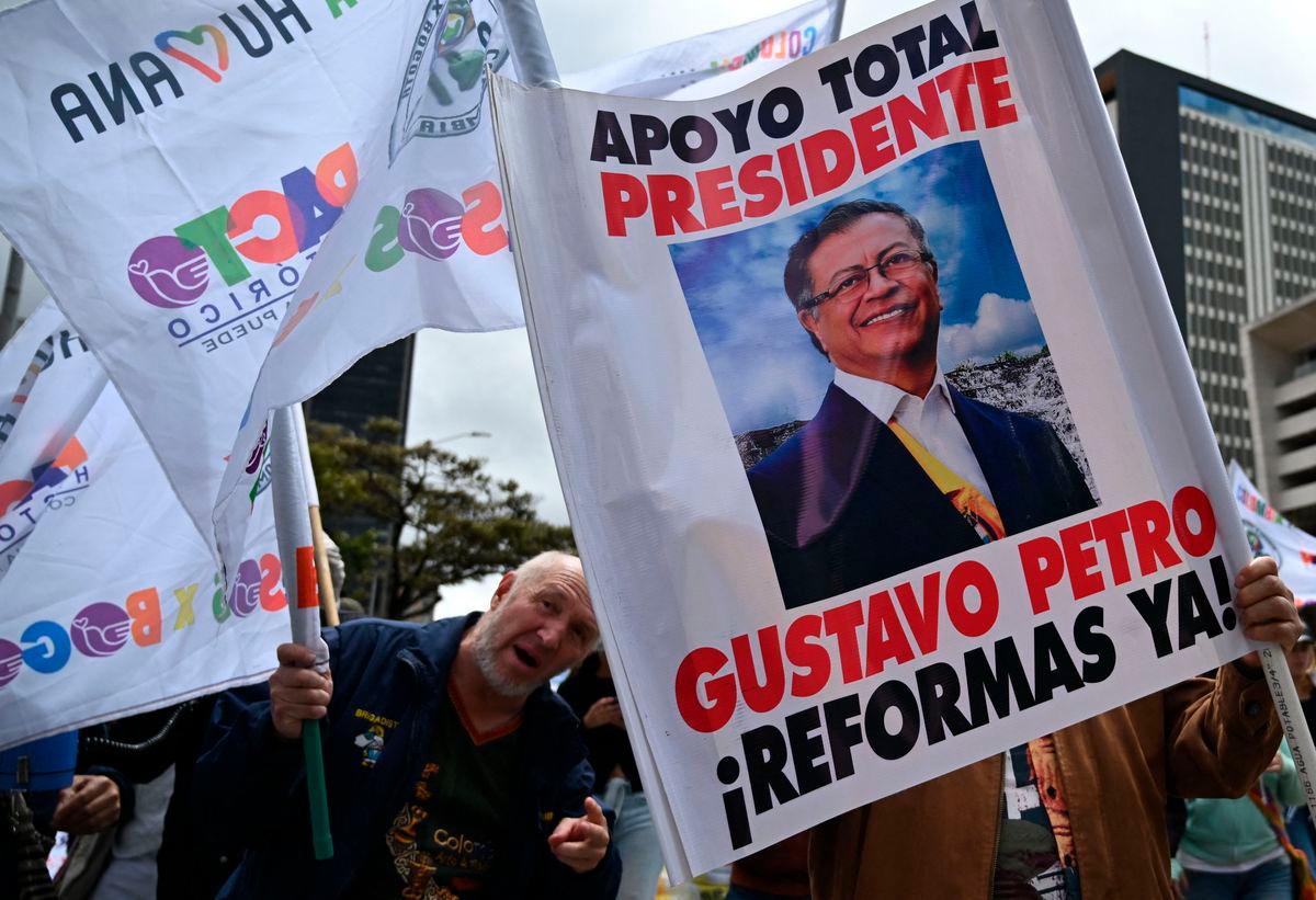 People wave allusive signs and flags during a march in favor of the reforms proposed by Colombia’s President Gustavo Petro during a strike called by unions in Bogota, Colombia, on May 28, 2025. AFPpix