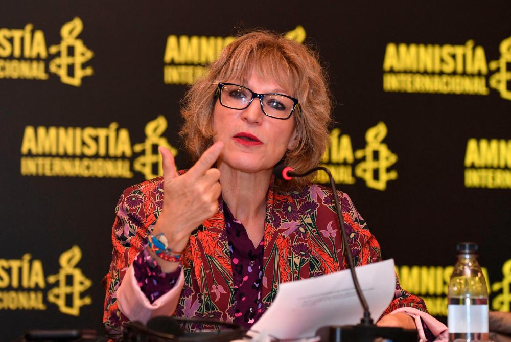 Agnes Callamard, secretary general of Amnesty International, gestures during a media briefing on gender and sexual violence perpetrated by the police during the 2021 national strike protests in Bogota on December 1, 2022. AFPPIX