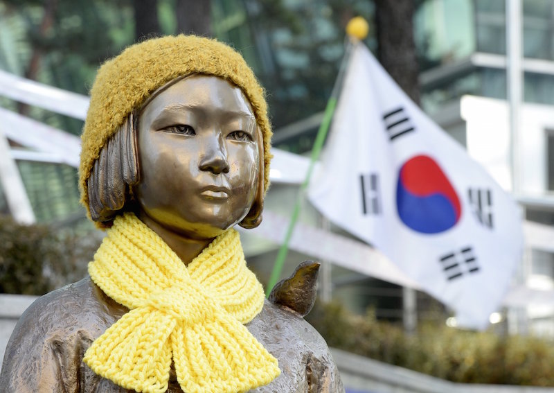 A statue of a girl that represents the sexual victims by the Japanese military is seen in front of Japanese embassy in Seoul, South Korea, Dec 28, 2015. — AFP