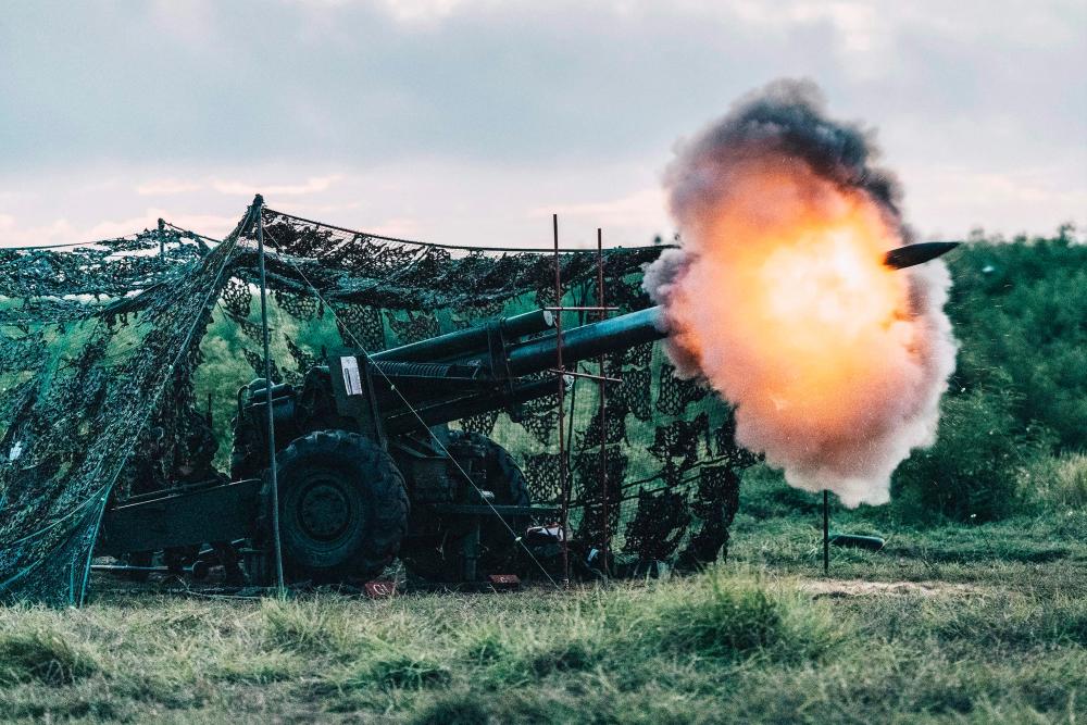 This Taiwan’s Ministry of National Defense handout picture taken and released on August 24, 2022 shows a US-made 155mm howitzer firing during a drill at Penghu islands. AFPPIX