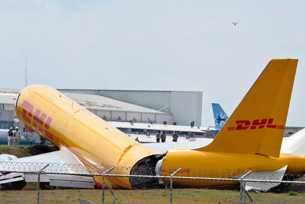 A DHL cargo plane is seen after emergency landing at the Juan Santa Maria international airport due to a mechanical problem, in Alajuela, Costa Rica, on April 7, 2022. AFPPIX