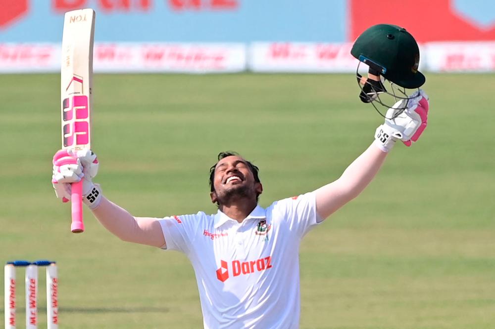 Bangladesh’s Mushfiqur Rahim reacts after scoring a century (100 runs) during the fourth day of the first Test cricket match between Bangladesh and Sri Lanka at the Zahur Ahmed Chowdhury Stadium in Chittagong on May 18, 2022. AFPPIX
