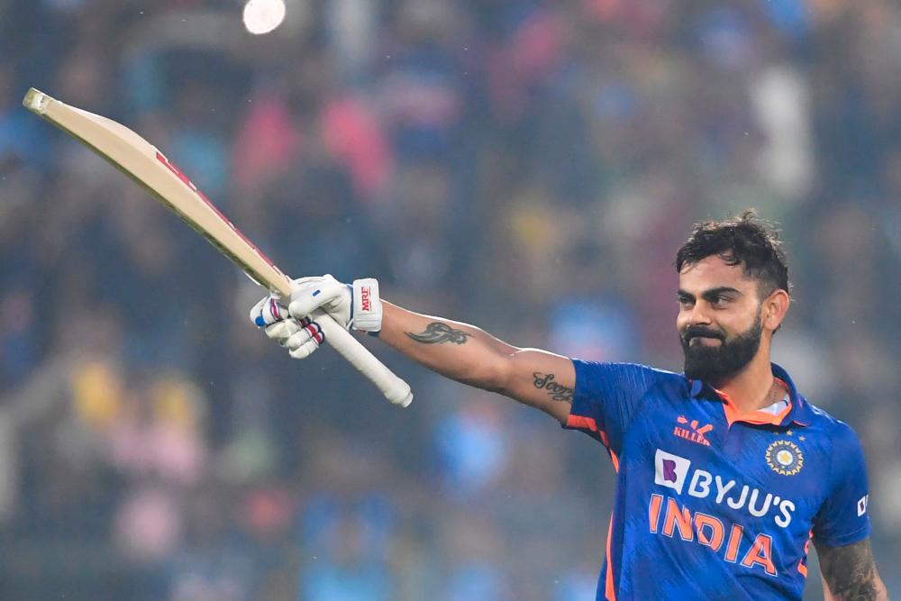 India’s Virat Kohli celebrates after scoring a century (100 runs) during the first one-day international (ODI) cricket match between India and Sri Lanka at the Assam Cricket Association Stadium in Guwahati on January 10, 2023/AFPPix
