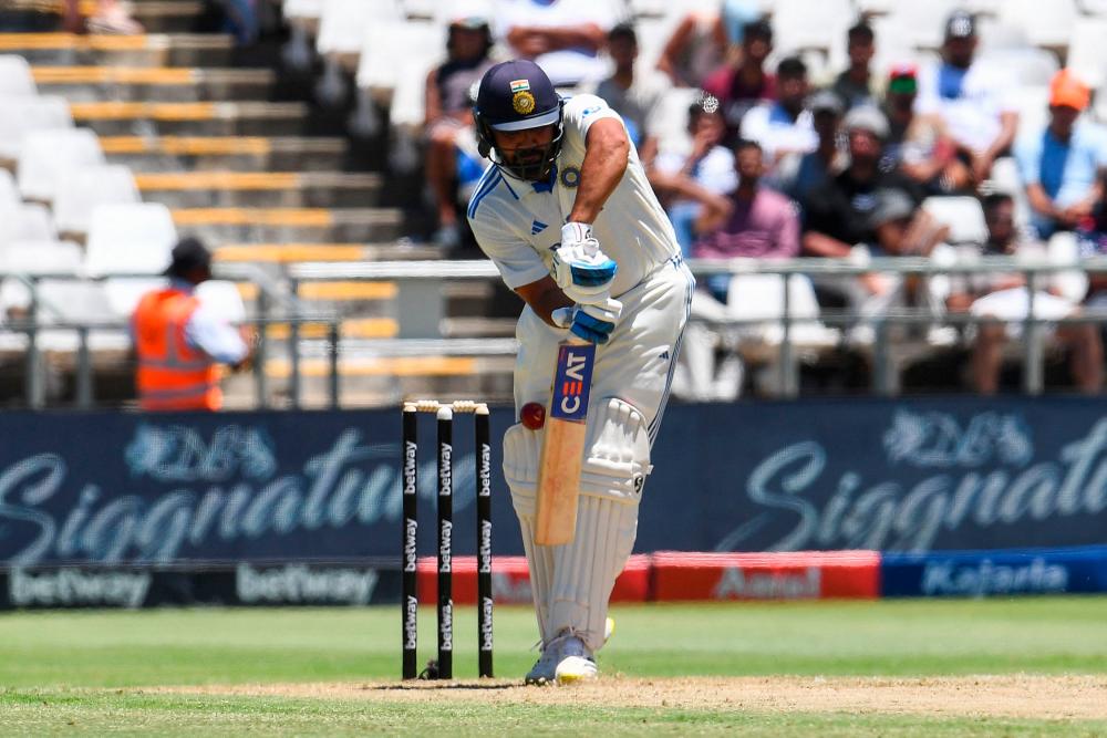 India’s Rohit Sharma is hit by a ball delivered by South Africa’s Marco Jansen (unseen) during the first day of the second cricket Test match between South Africa and India at Newlands stadium in Cape Town on January 3, 2024/AFPPix