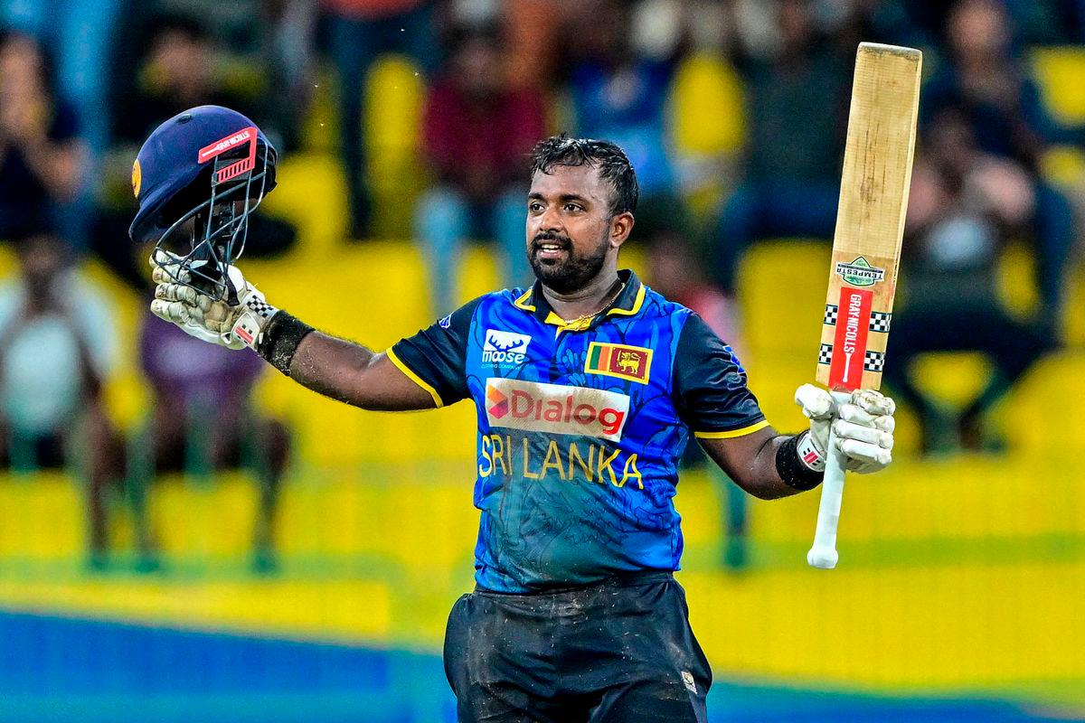 Sri Lanka’s captain Charith Asalanka celebrates after scoring a century (100 runs) during the first one-day international (ODI) cricket match between Sri Lanka and Bangladesh at the R. Premadasa International Cricket Stadium in Colombo on July 2, 2025. (Photo by Ishara S. KODIKARA / AFP)