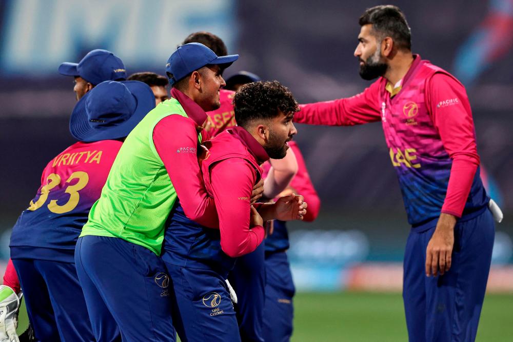 UAE players celebrate Alishan Sharafu’s catch to dismiss Namibia’s David Wiese during the ICC men’s Twenty20 World Cup 2022 cricket match between Namibia and United Arab Emirates at Kardinia Park in Geelong on October 20, 2022. AFPPIX