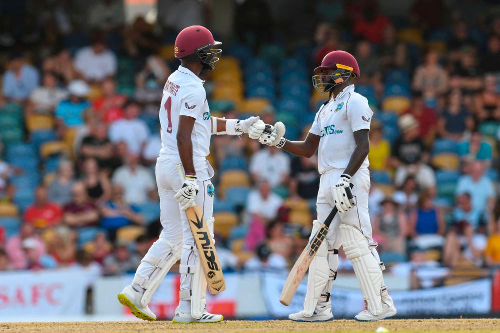 Jermaine Blackwood (R) and Kraigg Brathwaite (L) of West Indies 150 partnership during the 3rd day of the 2nd Test between West Indies and England at Kensington Oval, Bridgetown, Barbados, on March 18, 2022. AFPPIX