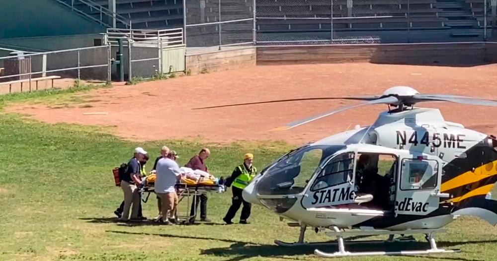 In this frame grab from a video courtesy of Horatio Gates recorded on August 12, 2022, Salman Rushdie is seen being loaded onto a medical evacuation helicopter near the Chautauqua Institution after being stabbed in the neck while speaking on stage in Chautauqua, New York. AFPPIX
