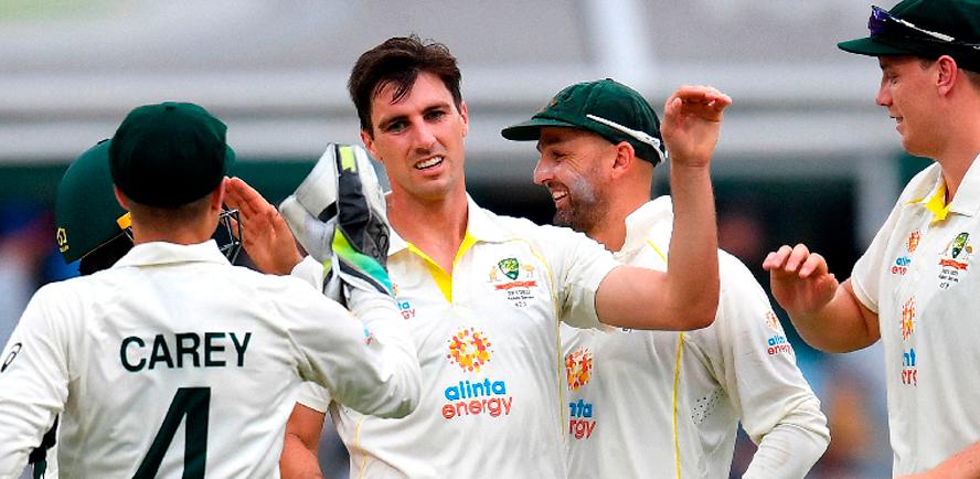 Australian Captain Pat Cummins (centre) celebrates taking a wicket during day one of the first Ashes cricket Test match against England at the Gabba in Brisbane on Dec 8, 2021. – AFPPIX