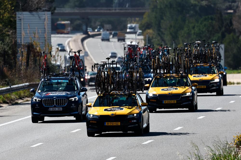 Team Jumbo-Visma’s crew cars (R) drive on a highway and carry the team’s bicycles after the 6th stage of the 81st Paris - Nice cycling race was canceled due to heavy winds, near Tourves, south-eastern France, on March 10, 2023. AFPPIX