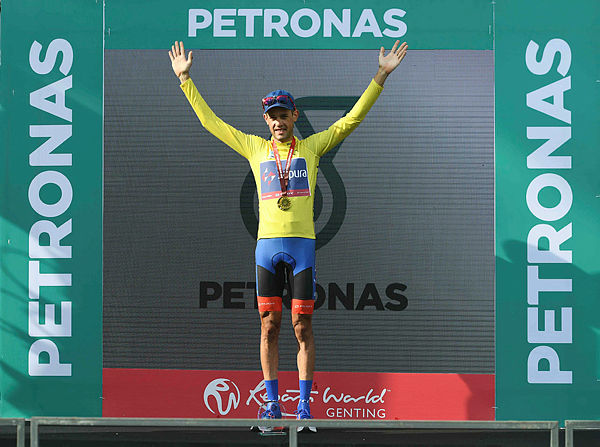 Yellow jersey Team Sapura Cycling’s Benjamin Dyball of Australia gestures on the podium after winning the Le Tour de Langkawi cycling race in Langkawi on April 13, 2019. — AFP