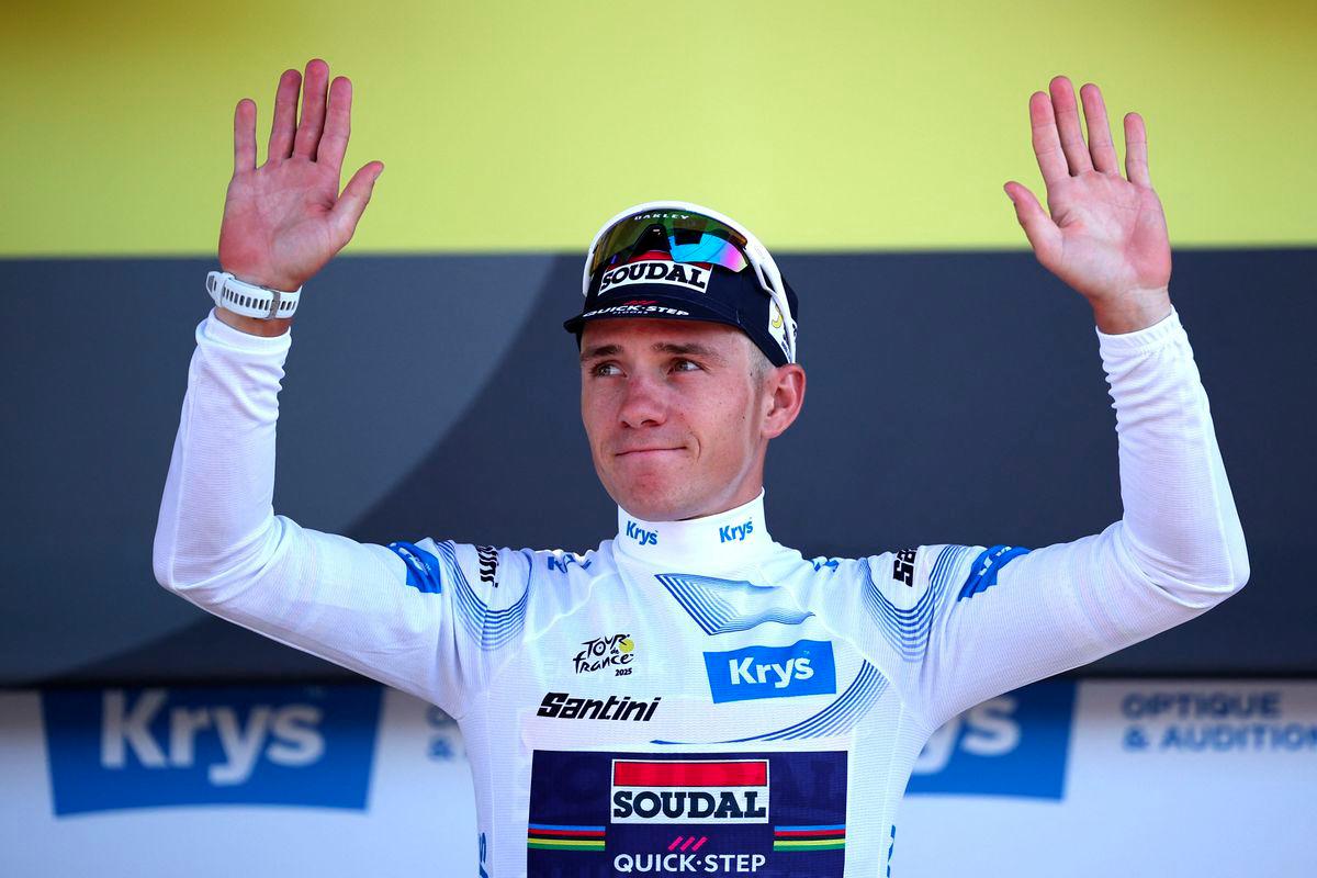 Soudal Quick-Step team's Belgian rider Remco Evenepoel celebrates on the podium with the best young rider's white jersey after the 13th stage of the 112th edition of the Tour de France cycling race, 10.9 km individual time trial between Loudenvielle and Peyragudes, in the Pyrenees mountains of southwestern France, on July 18, 2025. - AFPPIX
