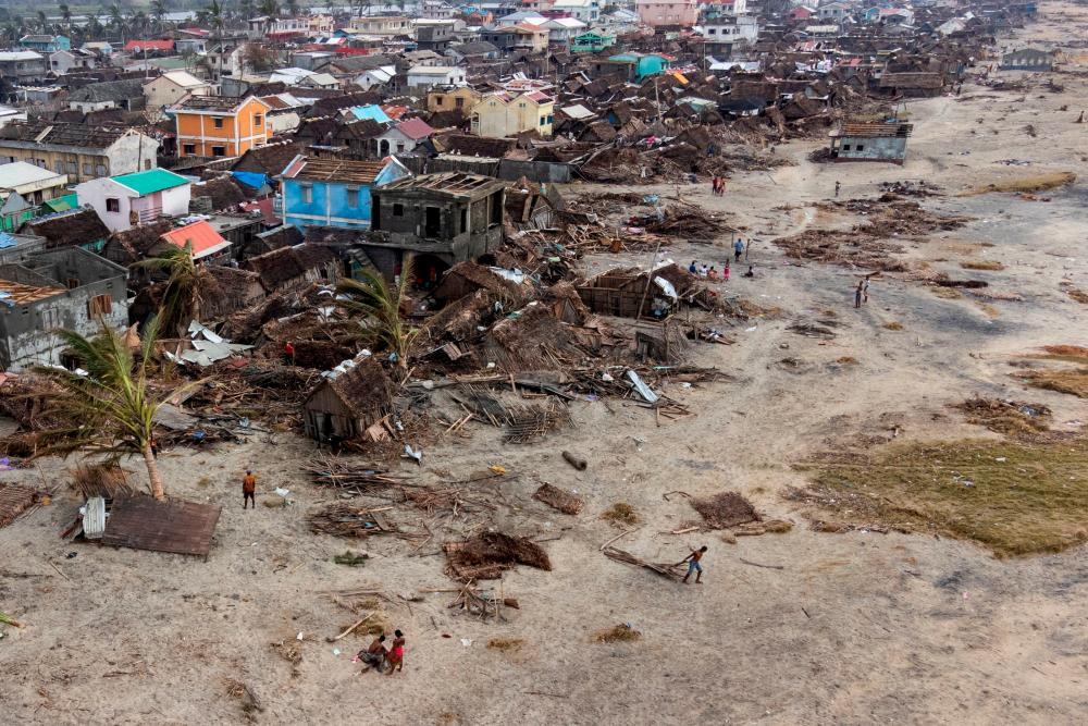File photo: An aerial view shows damaged houses and debris on the beach, in the aftermath of Cyclone Batsirai, in Mananjary, Madagascar, February 8, 2022. Picture taken with a drone. REUTERSpix