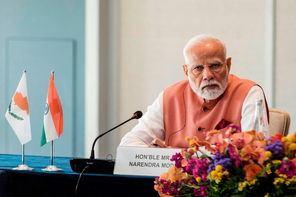 India’s Prime Minister Narendra Modi attends a business forum in Limassol on June 15, 2025. (Photo by Iakovos Hatzistavrou / POOL / AFP)
