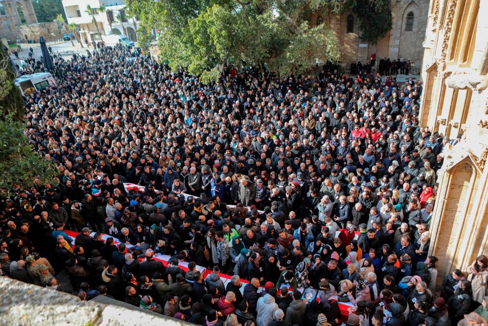 Mourners attend the funeral of Cypriot students killed in an earthquake that hit Turkey, in the eastern city of Famagusta, in the breakaway Turkish Cypriot statelet of northern Cyprus, on February 11, 2023/AFPPix