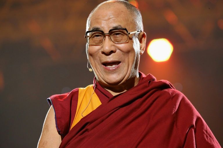 The Dalai Lama speaks at a concert at Syracuse University in 2012. — AFP