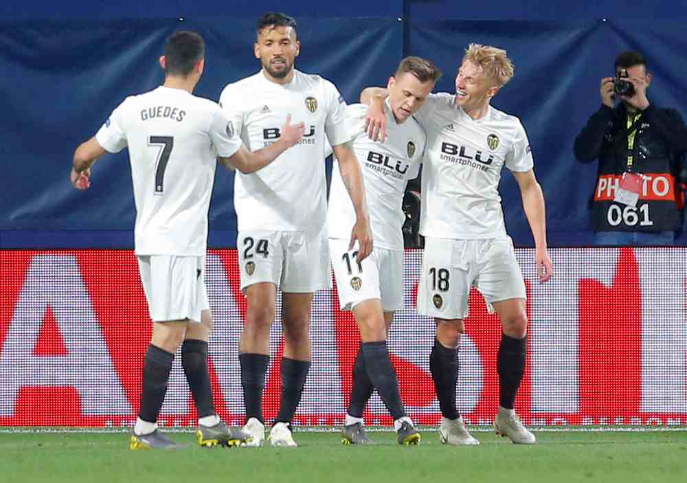 Valencia’s Daniel Wass celebrates with team mates after scoring the second goal against Villareal, April 11, 2019. ― Reuters