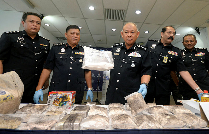 Selangor police chief Commissioner Datuk Noor Azam Jamaludin (3rd R) shows the drugs seized from a laboratory, during a press conference on Feb 25, 2019. — Bernama