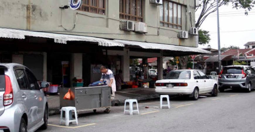 DBKL: Chairs And Rubbish Bins Used To ‘Chup’ Public Parking Lot Can Be Removed