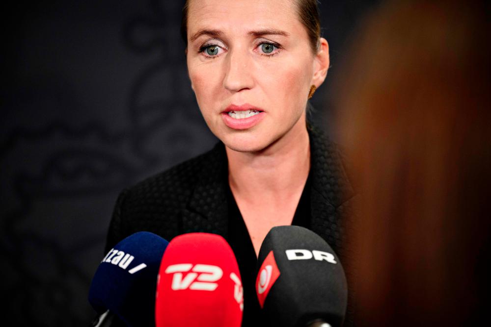 In this file photo taken on August 7, 2019 Danish Prime Minister Mette Frederiksen gives a statement in the Mirror Hall at Christiansborg, Copenhagen. — AFP