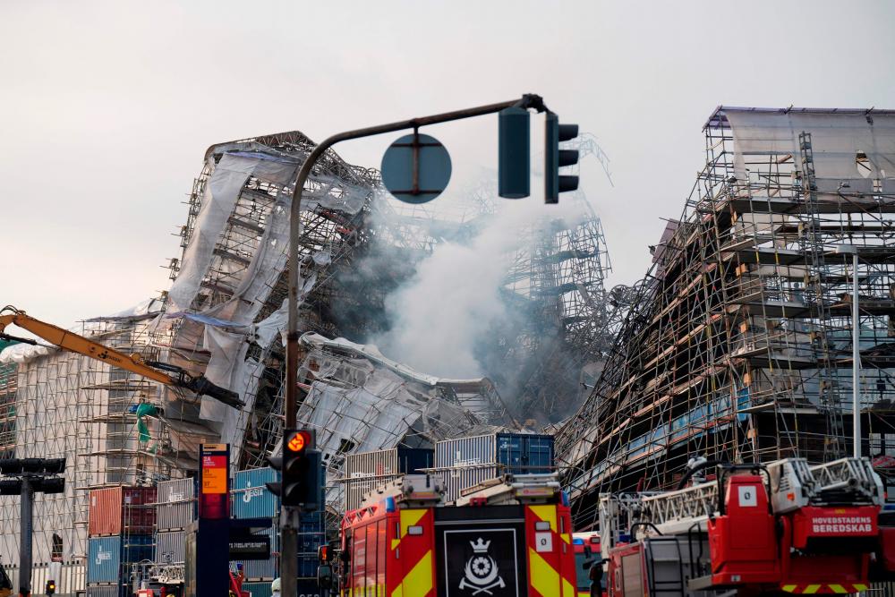 A photo shows the ruins after the outer wall has collapsed in a fire in the historical Boersen building, the former Stock Exchange in Copenhagen, on April 19, 2024/AFPPix