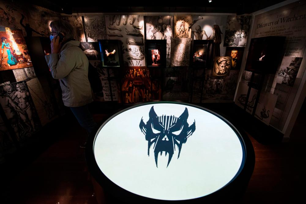 A woman visits the HEX!, a museum of Witch Hunt, on October 1, 2020 in Ribe, Denmark. Located in the home of a former witch hunter, the Hex! Museum of Witch Hunt sheds light on how a fear of witches led to persecutions that swept across Denmark and Europe in the 16th and 17th centuries. / AFP / Jonathan NACKSTRAND / TO GO WITH AFP STORY by Camille BAS-WOHLERT