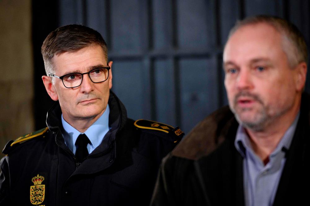 Joergen Bergen Skov (L), Copenhagen Police Chief Inspector, and Flemming Drejer (R), the head of the PET intelligence agency give a press conference at Copenhagen's main police station on Dec 11, following a police operation based on suspicions of preparations of terror attacks with militant Islamist motive. — AFP