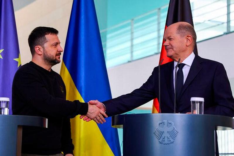 German Chancellor Olaf Scholz and Ukraine’s President Volodymyr Zelenskiy shake hands at a press conference in Berlin - REUTERSpix