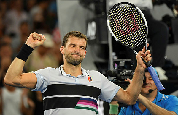 Bulgaria’s Grigor Dimitrov celebrates after victory over Italy’s Thomas Fabbiano in their men’s singles match on day five of the Australian Open. — AFP